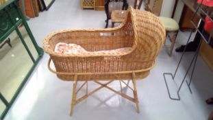 Cane and wicker cot and stand.