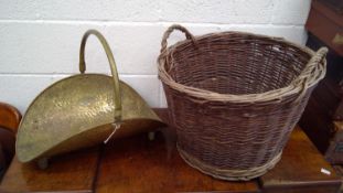 Large wicker log basket and a brass log basket.