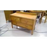 An Oak chest of low drawers, two short and one long. Height 70cm, width 105cm, depth 34cm