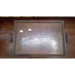 Antique oak tray with handles and carved decoration.