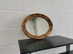 Oval wall hanging mirror. Width 48cm, height 37.5cm.