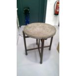 Benares style table, with folding stand. Diameter 60cm.