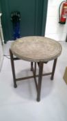 Benares style table, with folding stand. Diameter 60cm.