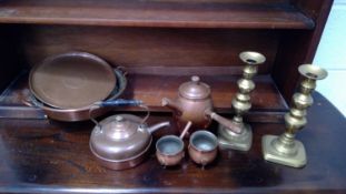 Copper hot chocolate pot, pair of brass candlesticks, copper kettle, and other copper items.