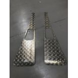 A pair of Land Rover wing chequer plate protectors.