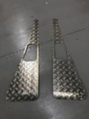 A pair of Land Rover wing chequer plate protectors.