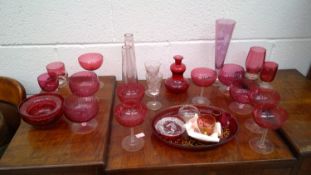 A set of cranberry glassware.