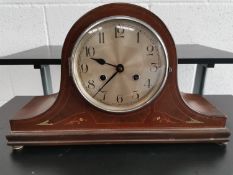 Magohany twin train chiming mantle clock with silvered face, includes winding key.