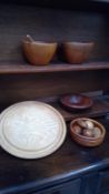 A Dave Regester wood turned ash breadboard signed, two teak turned bowls, a John Rockey turned