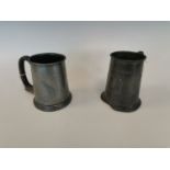 Two pewter tankards.