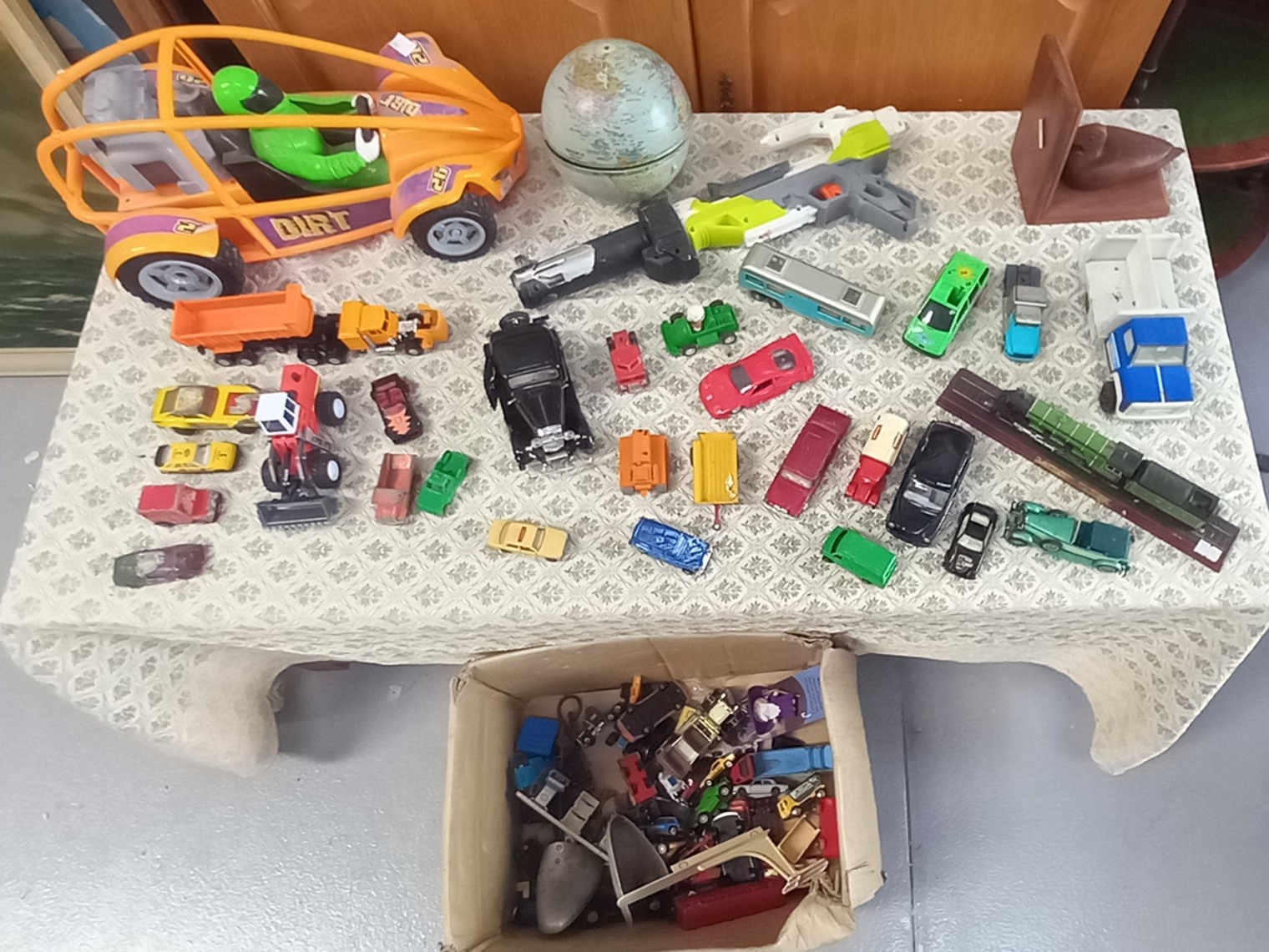 Corgi, Matchbox and other cars and toys in one box.
