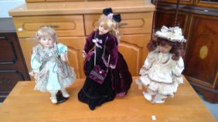 Three victorian style dolls, somersaulting monkey and a hobby horse.