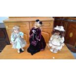 Three victorian style dolls, somersaulting monkey and a hobby horse.