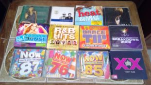 Pop music compilation CDs along with a small collection of other pop CDs.