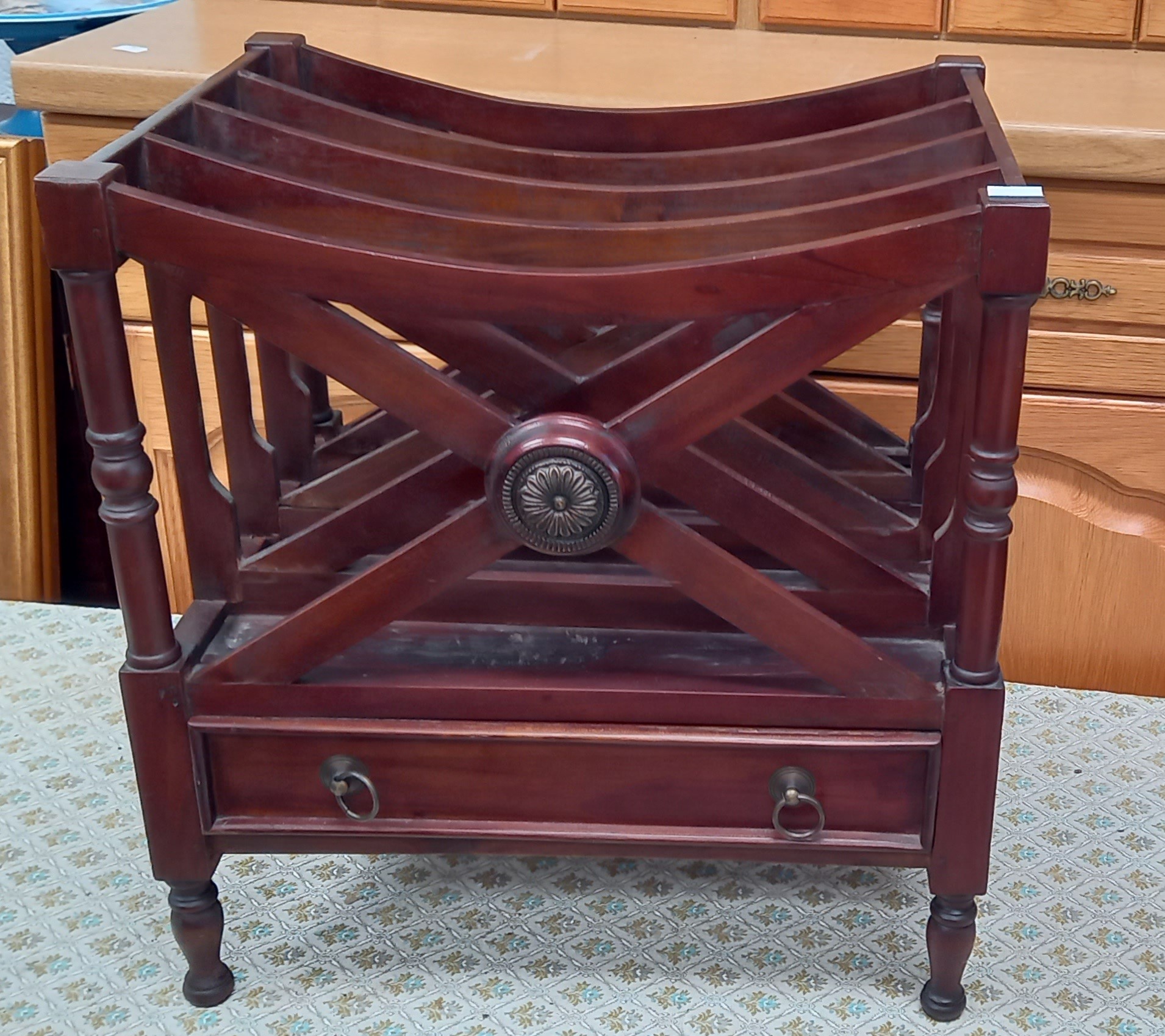 A mahogany criss-cross four section magazine rack with false drawer, 50cm tall, 38cm deep, 47cm