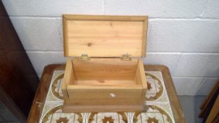 A small pine box, height 19.5cm, width 39cm, depth 19.5cm.