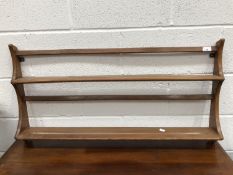 An Ercol hanging plate rack, height 50cm, width 95cm.