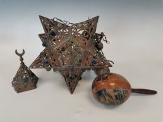 Brass dodecahedron hanging star lamp and a gourd maraca.