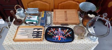 A cased knife set and electric knife sharpener, a soapstone religious figurine, a Rumtopft storage