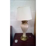 A ceramic table lamp, with brass mounts.