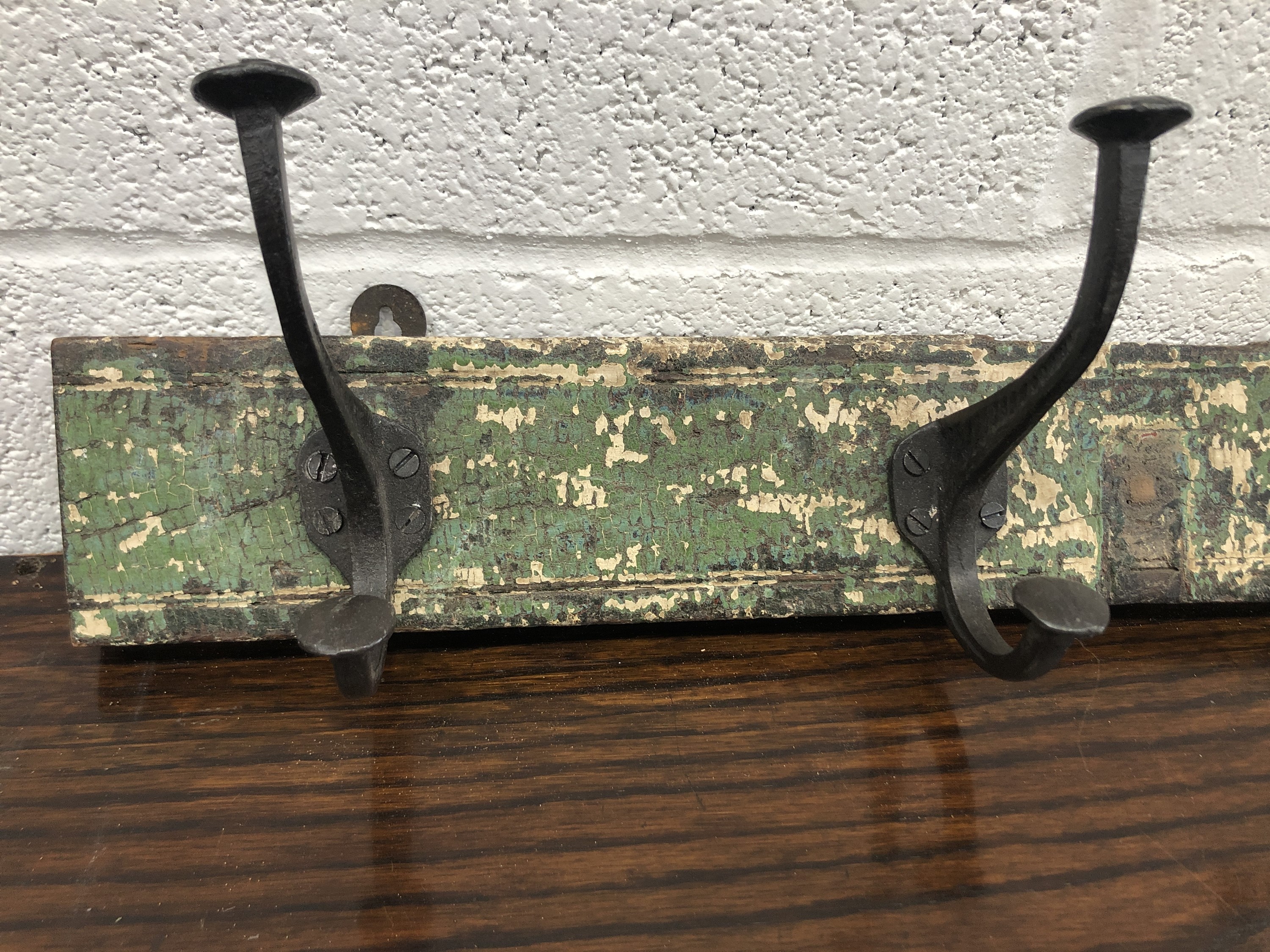 A set of metal coat hooks, attached to a rectangular wood panel. The hooks previously purchased from - Image 2 of 3