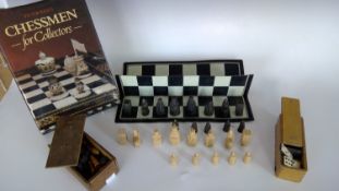 Part Isle of Lewis chess set replica, a wood box with wood turned chess pieces, ebony and bone