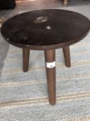 A hardwood stool, the circular top on three legs, height 32cm, diameter 32cm.