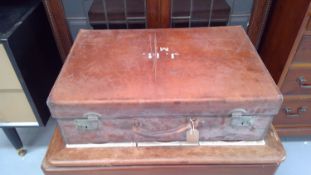 Vintage leather suitcase, contains knitted cardigans, shirts, etc.