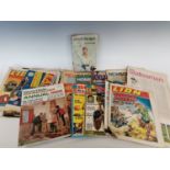 'Biggles Flies Again' by W.E. Johns and a collection of magazines from the 1960s.