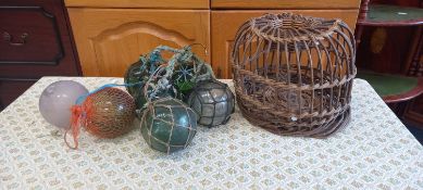 Seven vintage glass fishing floats, one damaged.