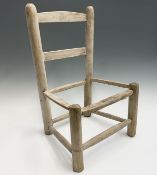 A pine ladderback child's chair frame. Height 53.5cm, width 35.5cm, depth 28cm.Condition report: