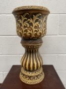 A ceramic jardiniere and stand