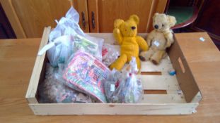 A box of young children's toys including a pair of vintage teddys, jigsaw puzzles, etc.