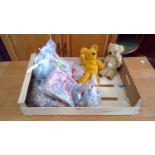 A box of young children's toys including a pair of vintage teddys, jigsaw puzzles, etc.