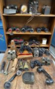 A collection of binoculars, opera glasses, a metronome etc in one box