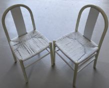 A pair of painted bentwood rush chairs