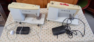 Two Singer Sewing machines.