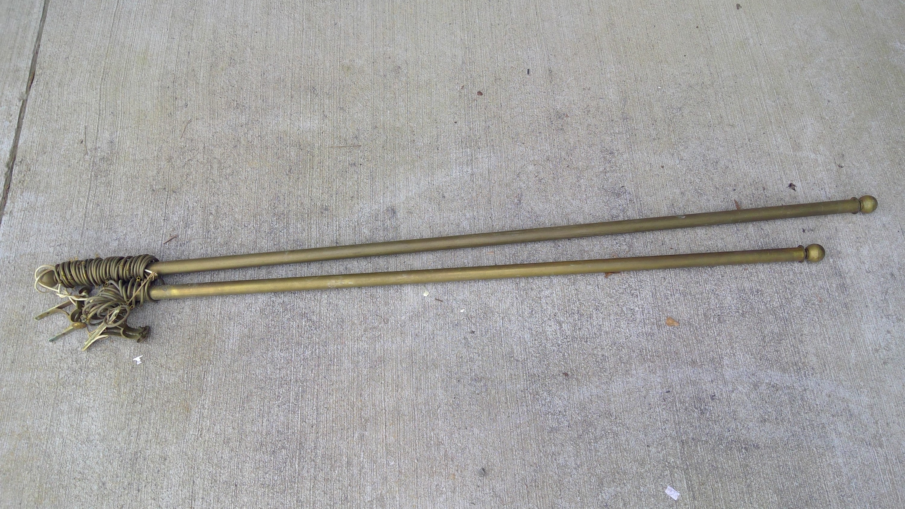 Brass curtain poles, and another shorter brass curtain rod, largest 191cm.
