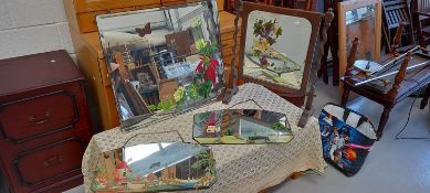 Four handpainted mirrors, two with Dutch windmill scenes, another with a wooden frame and stand.