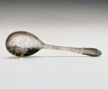 A Georg Jensen Ltd silver straining spoon in Kugle Beaded pattern, with pierced bowl, London 1938,