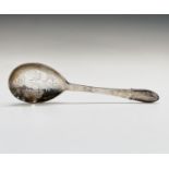 A Georg Jensen Ltd silver straining spoon in Kugle Beaded pattern, with pierced bowl, London 1938,