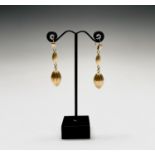 A pair of contemporary 18ct gold matt earrings each with a fluted drop 7.8gm Condition: Excellent