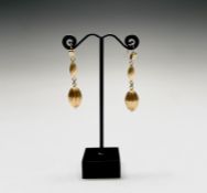 A pair of contemporary 18ct gold matt earrings each with a fluted drop 7.8gm Condition: Excellent