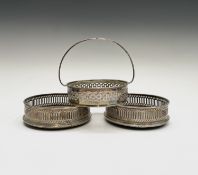 A pair of pierced silver wine coasters by Mills & Hersey 1979 together with a pierced butter dish