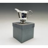 A silver cream jug, 3.1oz, London 1939 together with an epns collectors bell Condition: In good used