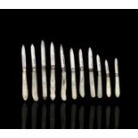 A collection of eleven silver bladed folding fruit knives, each with mother of pearl scales