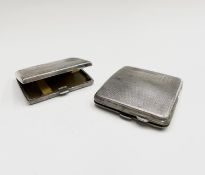 Two engine-turned silver cigarette cases, 7.1oz. Condition: Each closes reasonably well - each has