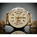 An Avia 9ct gold cased chronograph wristwatch 36mm diameter 52.8gm including gilt bracelet.