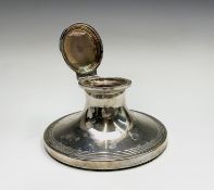 A silver capstan inkwell with reeded borders by S Blanckensee & Son Ltd Birmingham 1909, Diameter