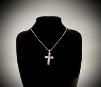 An 18ct white gold cross pendant set with brilliant-cut diamonds on an 18ct white gold snake